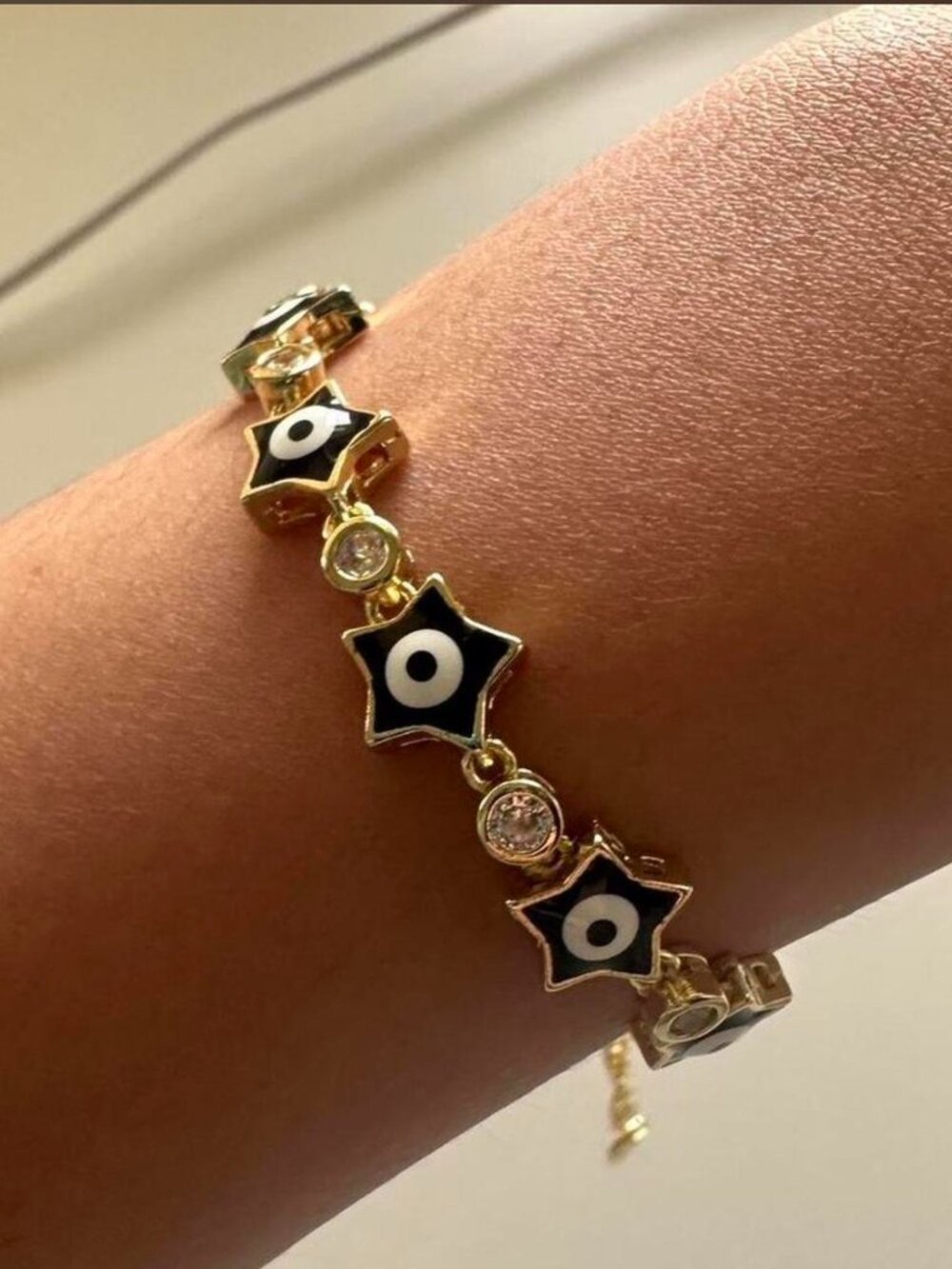 Gold Bracelet with Black Stars and Gems